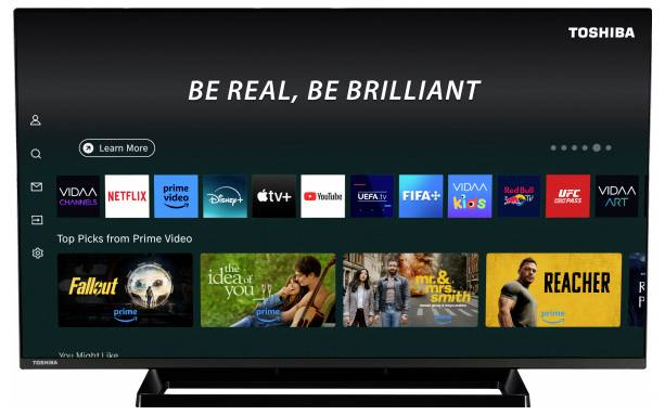 Ein Smart-TV-Bildschirm mit Streaming-Dienst-Icons wie Netflix, Prime Video und Disney+. Die Kopfzeile liest sich: „Sei echt, sei brillant