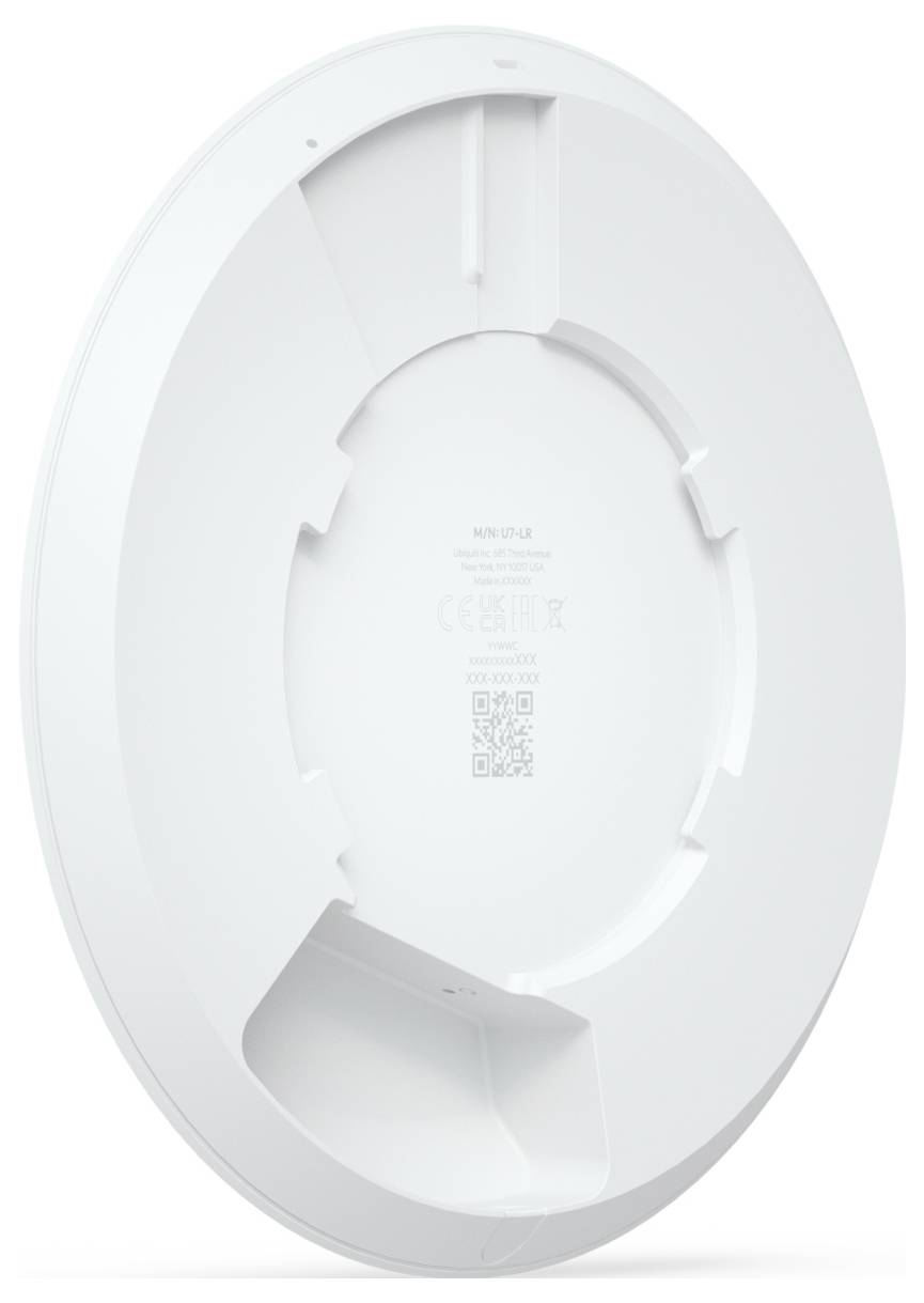 Ein rundes, weißes elektronisches Gerät, von hinten gezeigt, mit einer zentralen kreisförmigen Vertiefung und verschiedenen Beschriftungen, höchstwahrscheinlich ein Halterungs- oder Zugangspunkt.