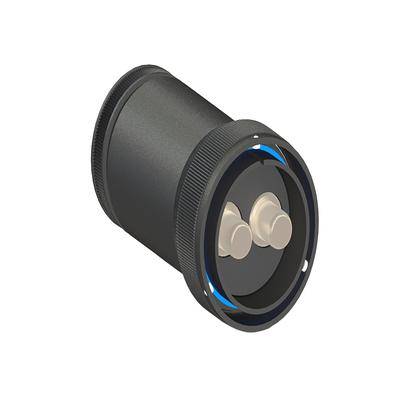 Ein schwarzes, zylindrisches mechanisches Teil mit gerilltem Rand weist zwei beige hervorstehende Teile an seinem kreisförmigen Ende auf.