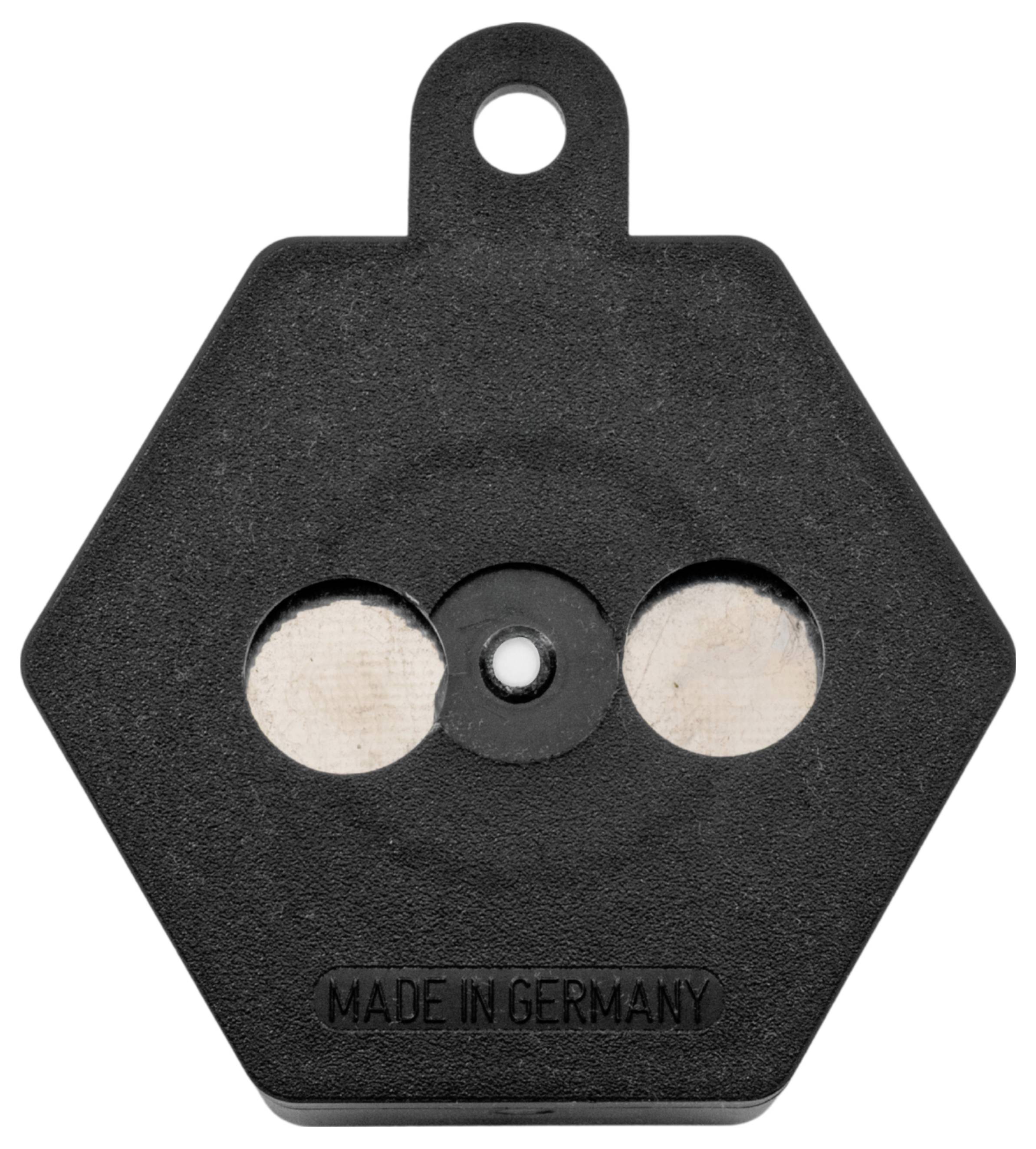 Ein schwarzes Sechseckgewicht mit einem kleinen Loch oben zum Aufhängen und zwei sichtbaren Metallscheiben. Text liest sich unten als 