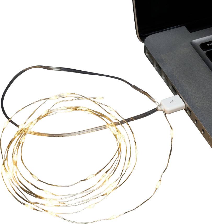 Eine aufgewickelte Reihe kleiner LED-Lichter, die über USB mit einem Laptop verbunden sind und sanft neben der Laptoptastatur leuchten.