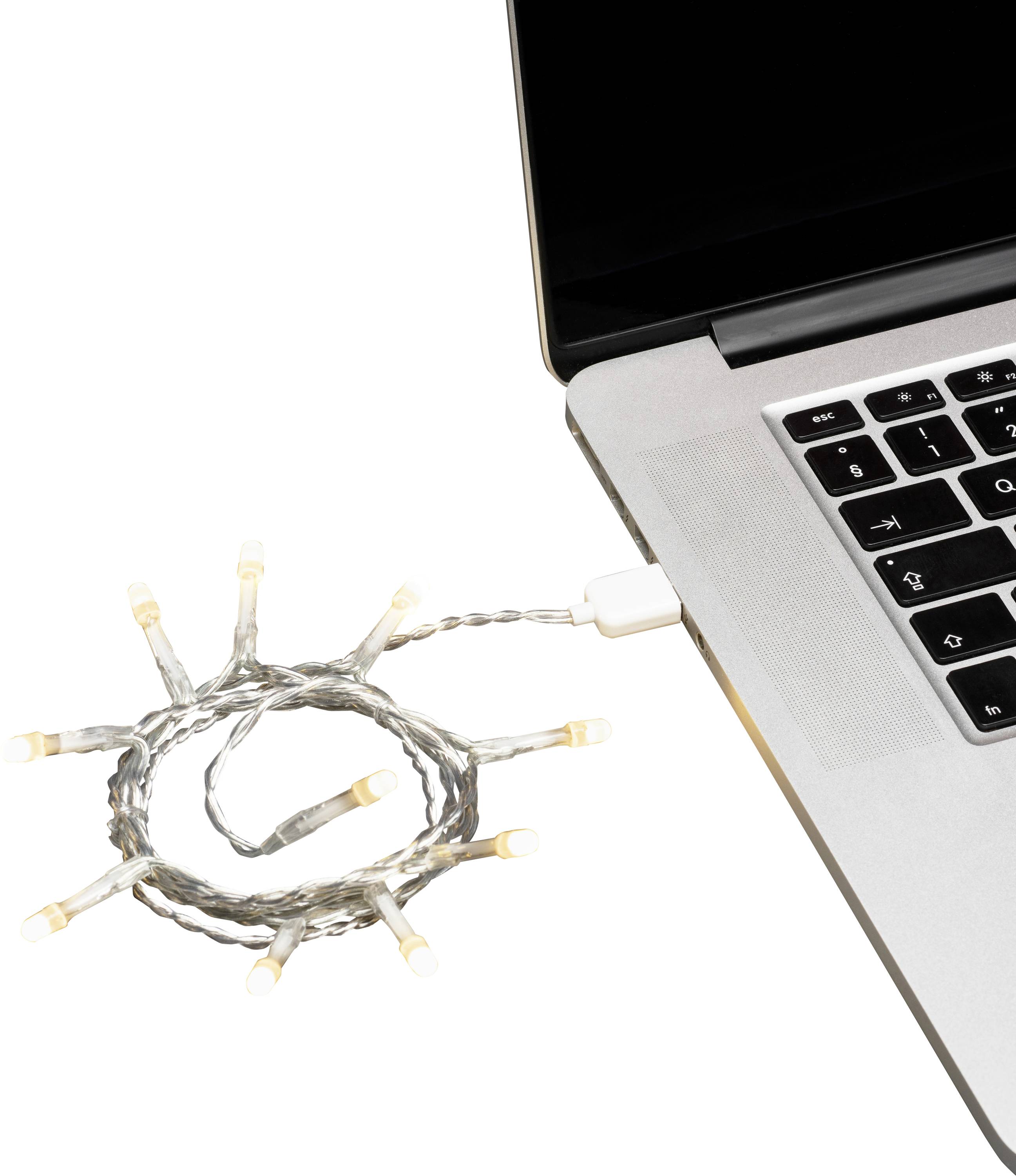 Eine kurze Kette von LED-Lichterketten ist in einen Laptop-USB-Anschluss eingesteckt und leuchtet sanft.