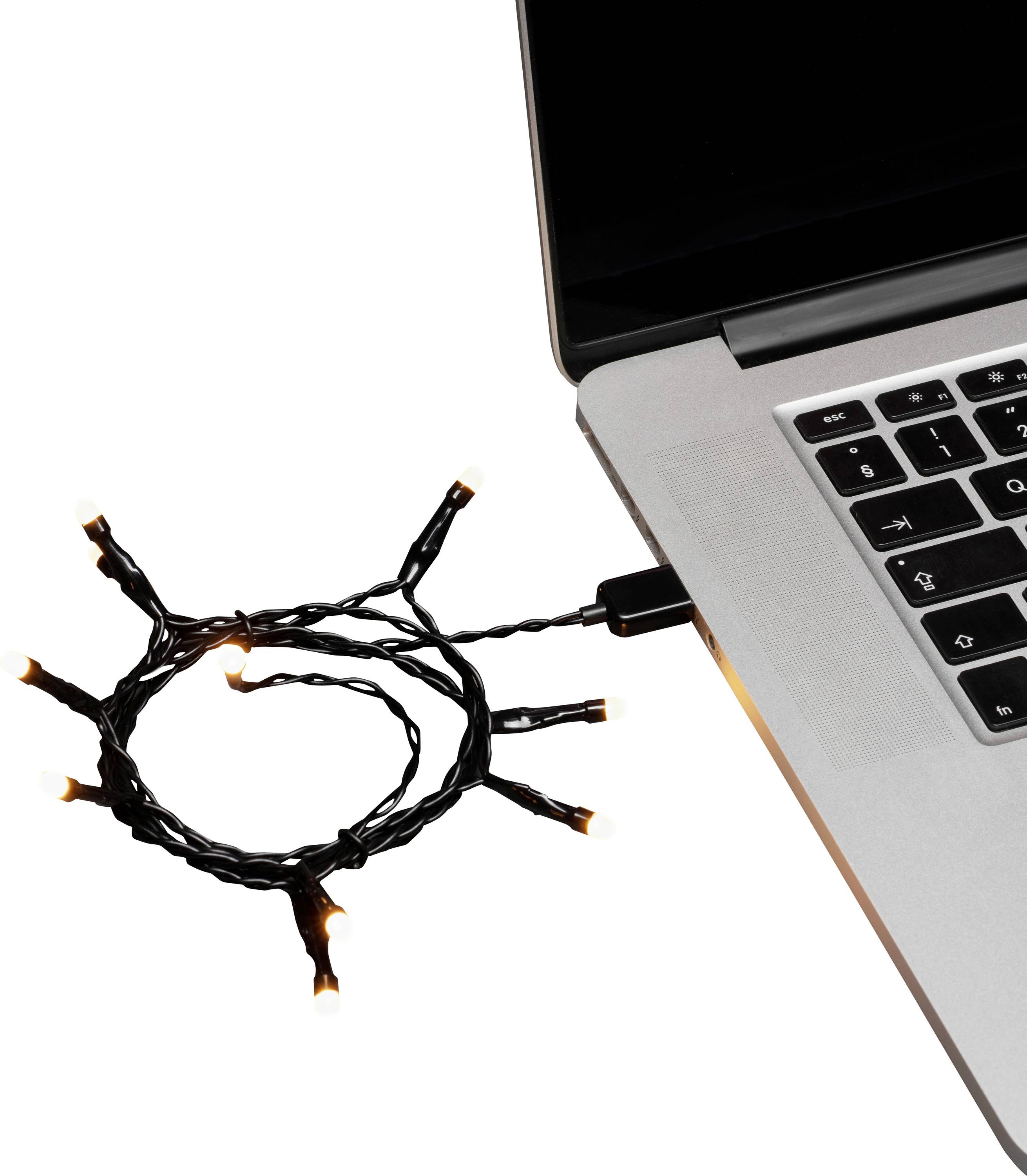 Eine Reihe kleiner orangefarbener Lichter, die an den USB-Anschluss eines Laptops angeschlossen und eingeschaltet sind, leuchtend und in Form eines kreisförmigen Loops neben der Tastatur.