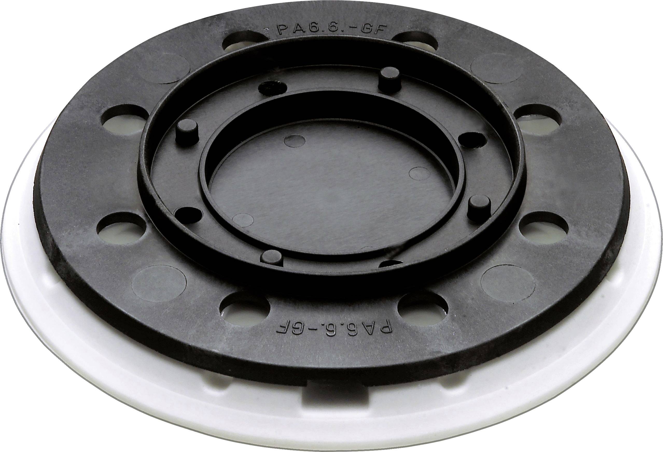 Eine runde schwarze und weiße Kunststoffkomponente mit kreisförmigen Vertiefungen und einem zentralen Ring, möglicherweise Teil eines größeren mechanischen Bauteils.