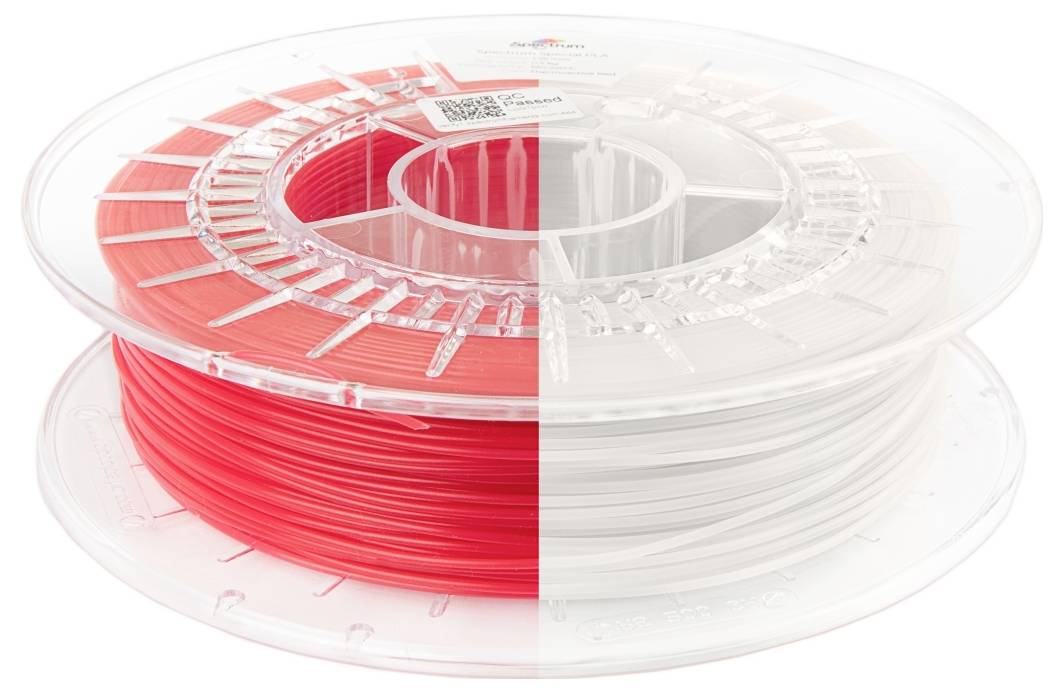 Zwei Rollen von 3D-Druckerfilament nebeneinander, eine rote und eine weiße, die Farboptionen für 3D-Druckmaterialien demonstrieren.