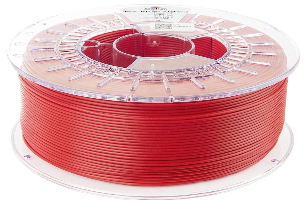Eine Rolle rotes 3D-Druckerfilament, sauber auf einer transparenten Plastikspule gewickelt, zur Verwendung für 3D-Druckprojekte.