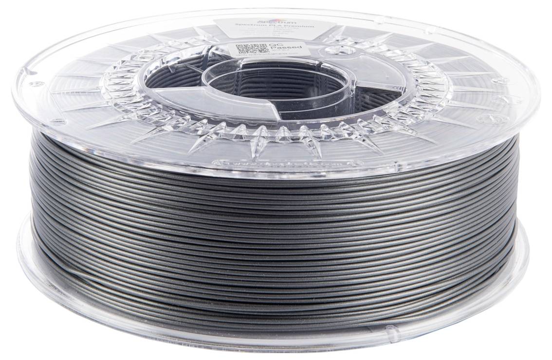 Eine Spule grauen 3D-Druckerfilaments auf einer transparenten Plastikrolle, die eng gewickelte Filamentschichten zeigt, die für die Verwendung bereit sind.