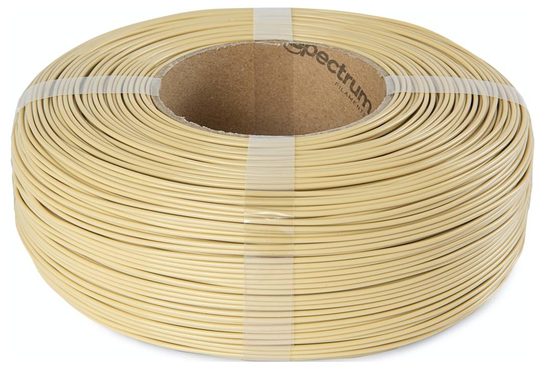 Eine Spule beige-farbenen Kunststofffilaments für den 3D-Druck.