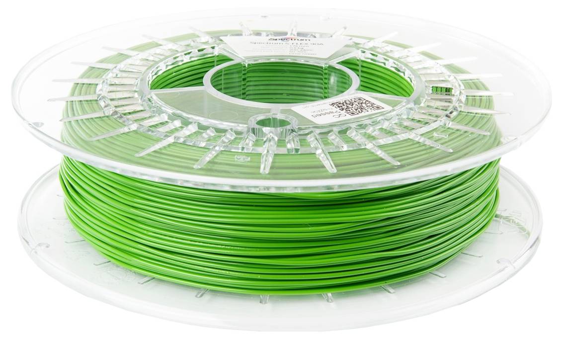 Eine Rolle grünes 3D-Druckerfilament mit einem transparenten Plastikhalter, verwendet zum Erstellen von 3D-gedruckten Objekten.