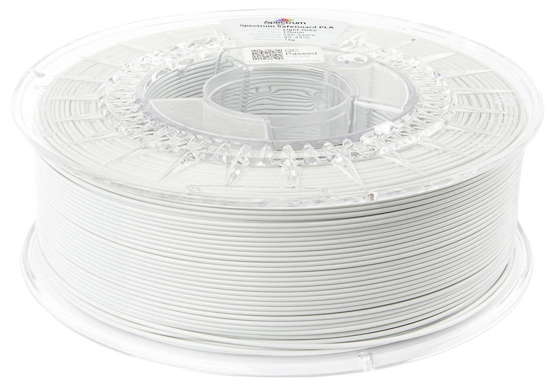 Eine Spule weißen 3D-Druckerfilaments auf einer transparenten Kunststoffspule, beschriftet mit 'Spectrum Filaments', wiegt 1 Kilogramm.