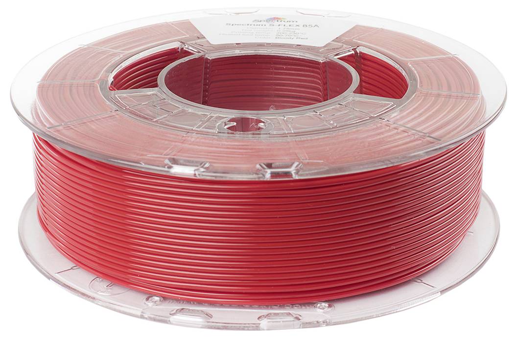Eine rote Spule von 3D-Druckerfilament, sauber aufgewickelt, liegt horizontal auf einer weißen Oberfläche.