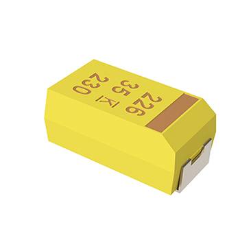 Eine gelbe elektronische Komponente, ähnlich wie ein Kondensator, mit den Nummern „332 26