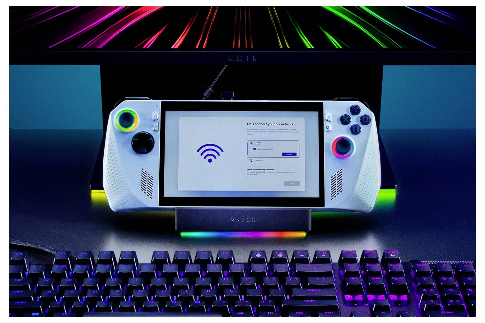 Eine Spielkonsole mit einem Bildschirm zeigt eine WLAN-Verbindungseinrichtung. Bunte LED-Lichter umrahmen das Gerät, und unterhalb befindet sich eine Tastatur.