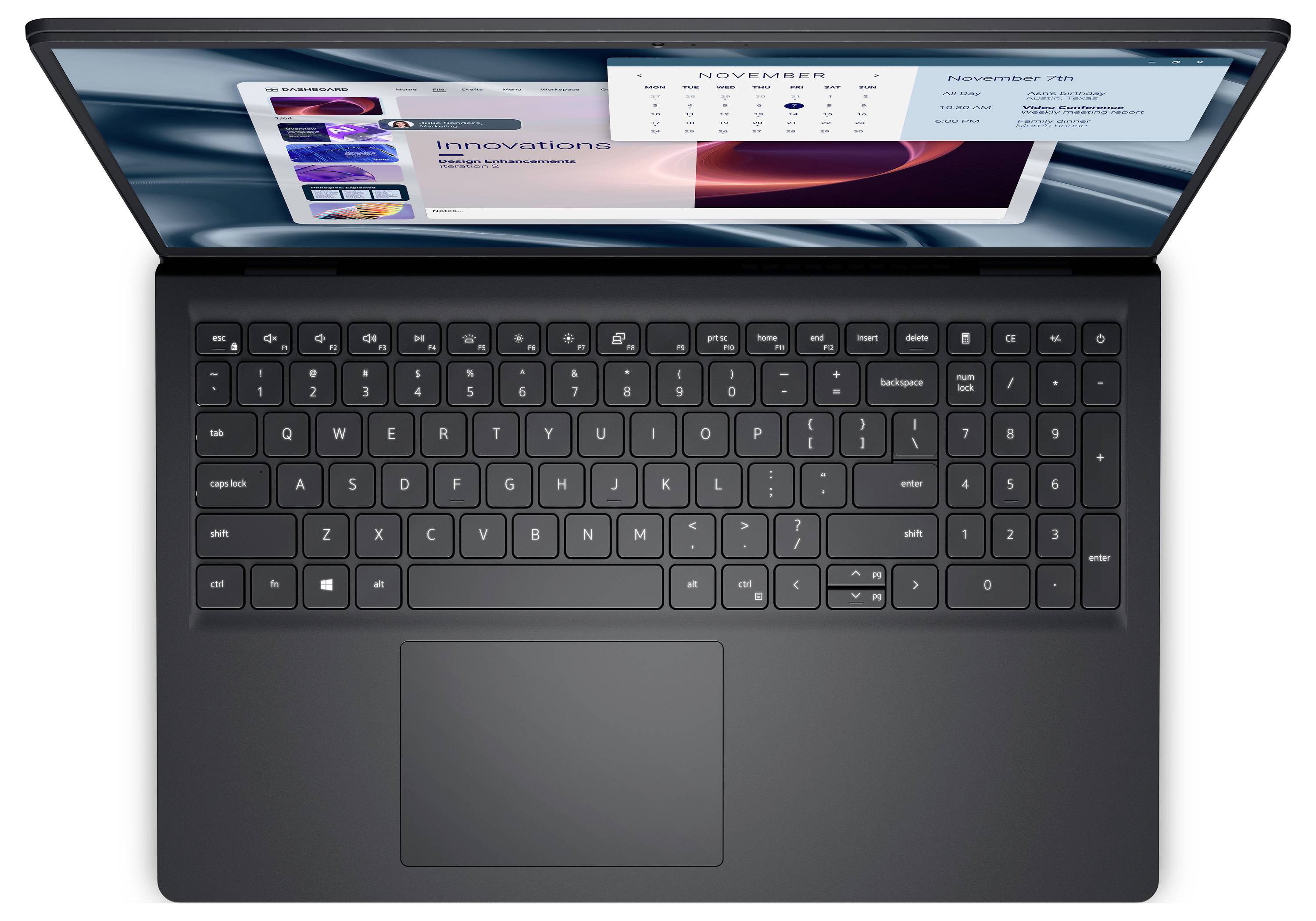 Ein schwarzer Laptop mit sichtbarer Tastatur, auf dessen Bildschirm ein Kalender für November und eine Beschriftung 