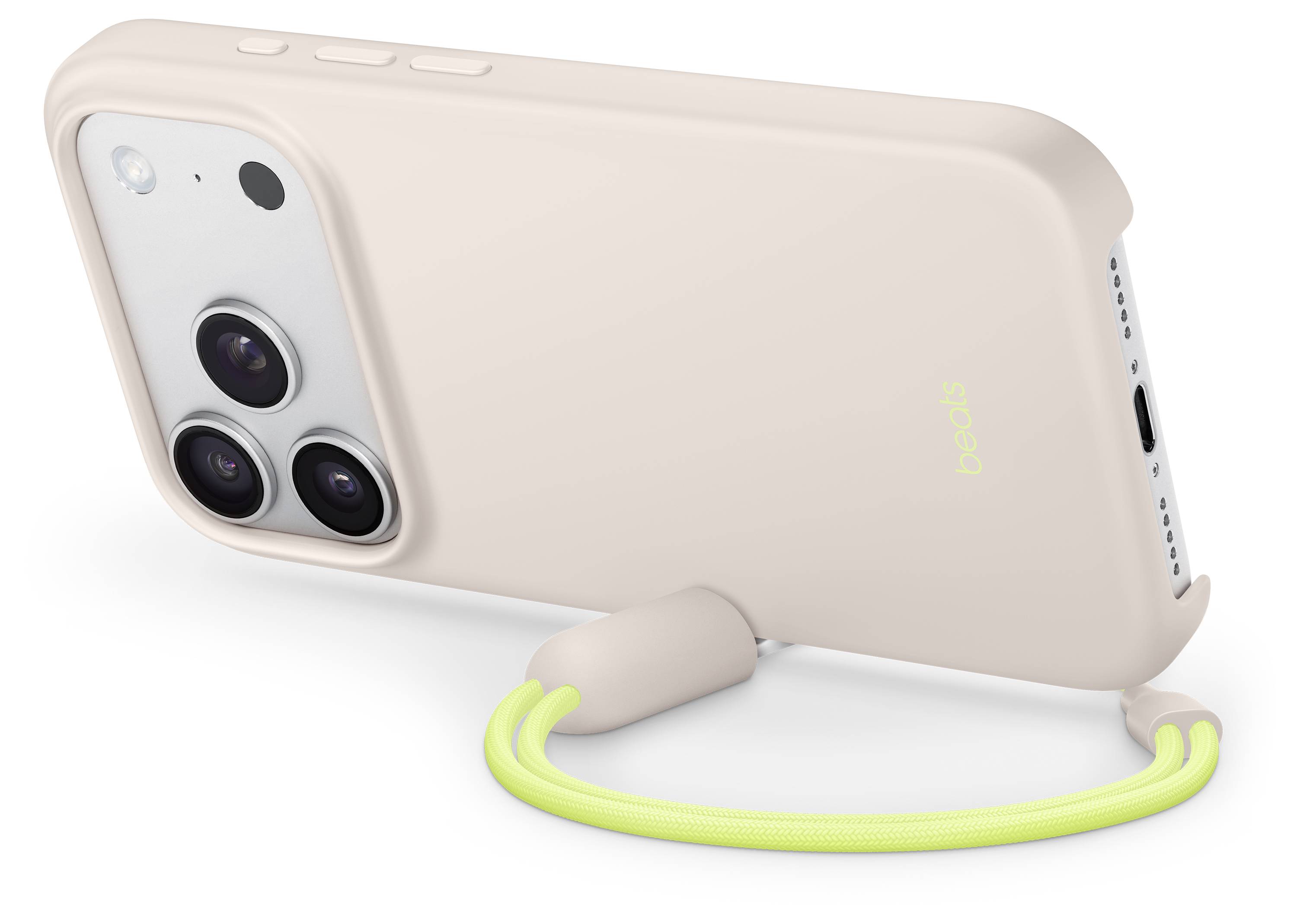 Ein Smartphone mit einer cremefarbenen Hülle, das drei Rückkameras aufweist und mit einem neongelben Seil an der Hülle aufgestellt ist.