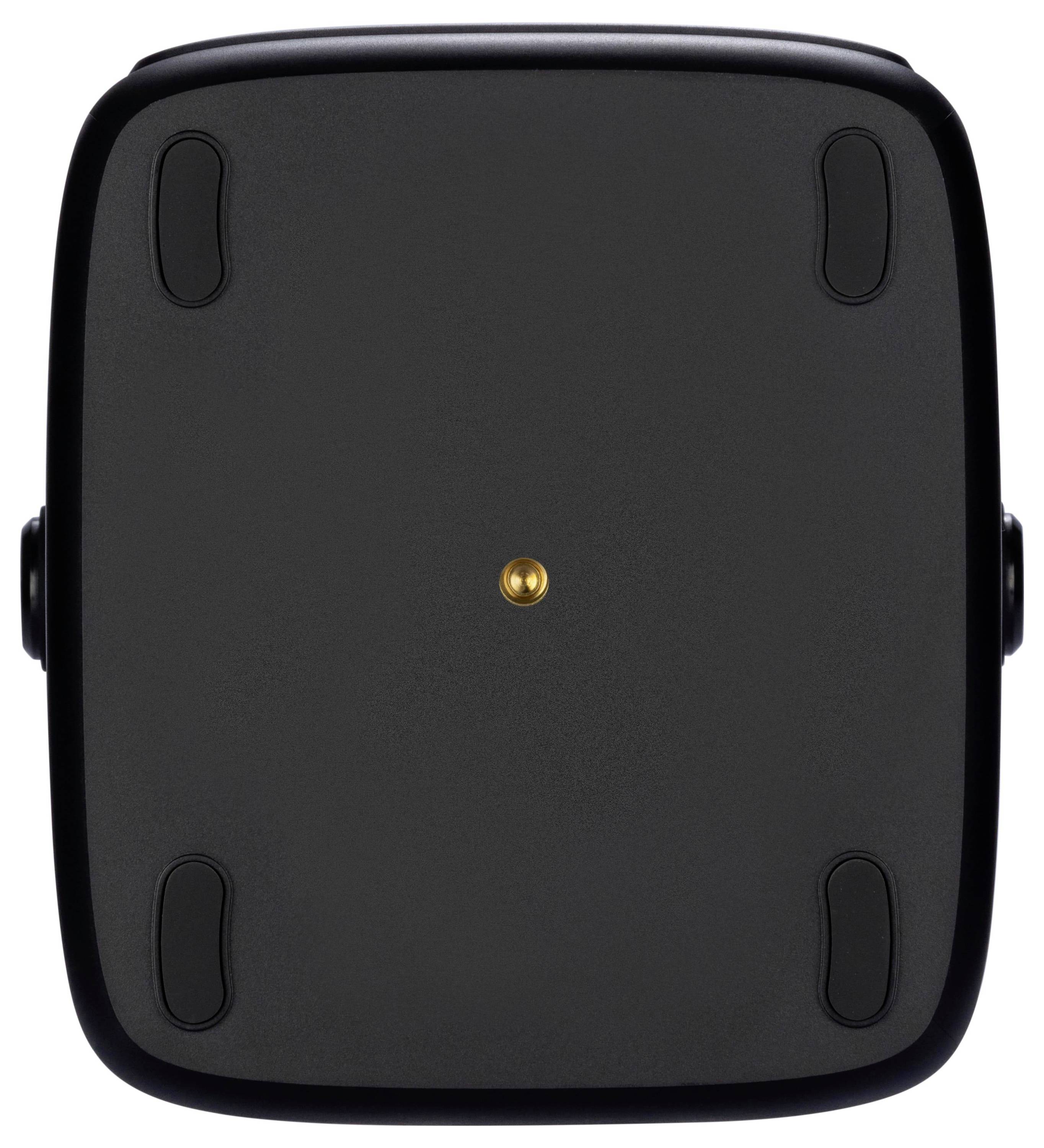 Ein schwarzes rechteckiges Objekt mit abgerundeten Kanten, das vier Gummifüße und einen zentralen goldenen Stift auf einer flachen Oberfläche, möglicherweise dem Boden eines Geräts, aufweist.