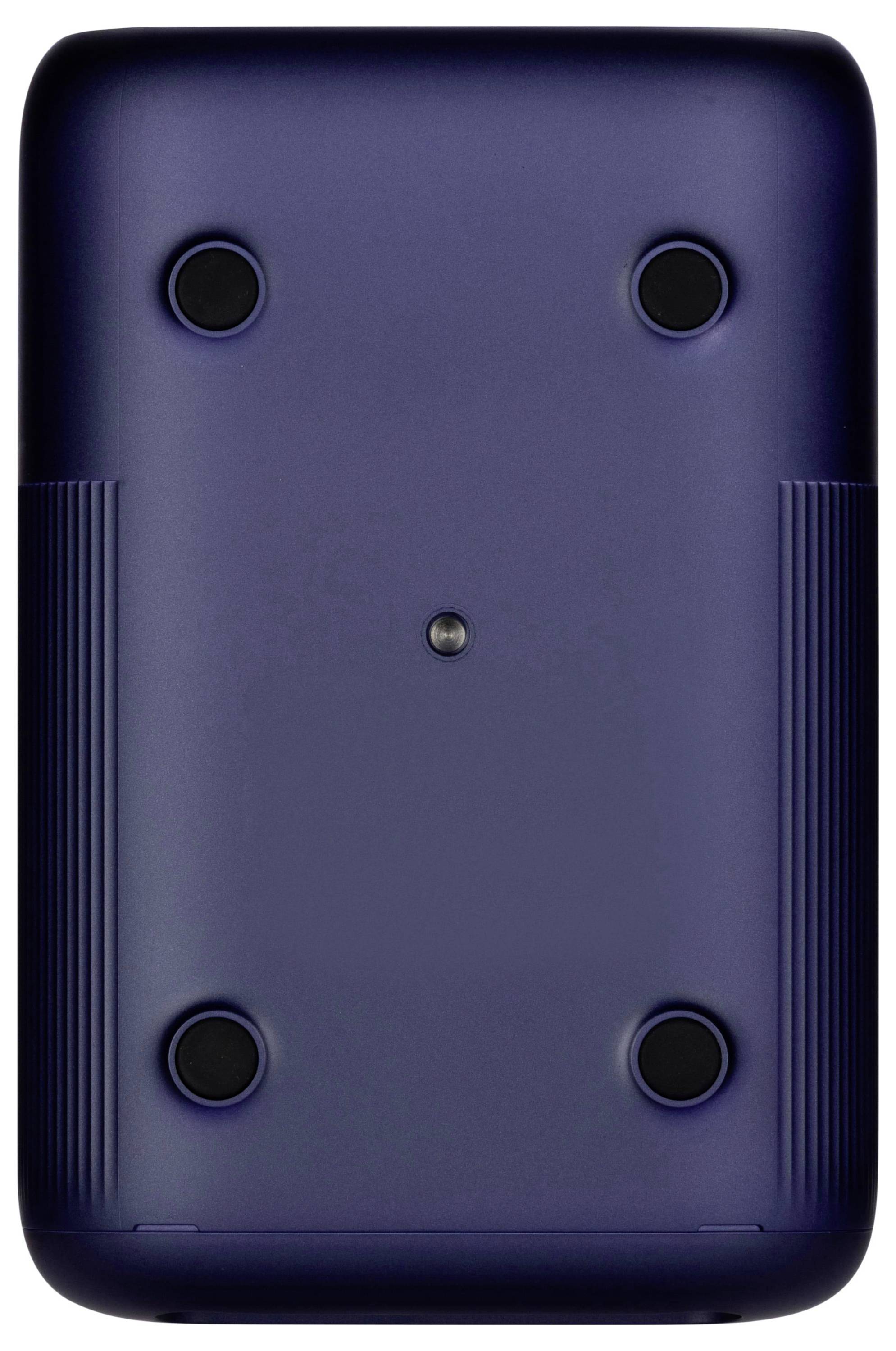 Das Bild zeigt die Rückseite eines dunkel gefärbten elektronischen Geräts mit vier runden Gummifüßen und einer zentralen Schraube, wahrscheinlich für Stabilität und Zugang.