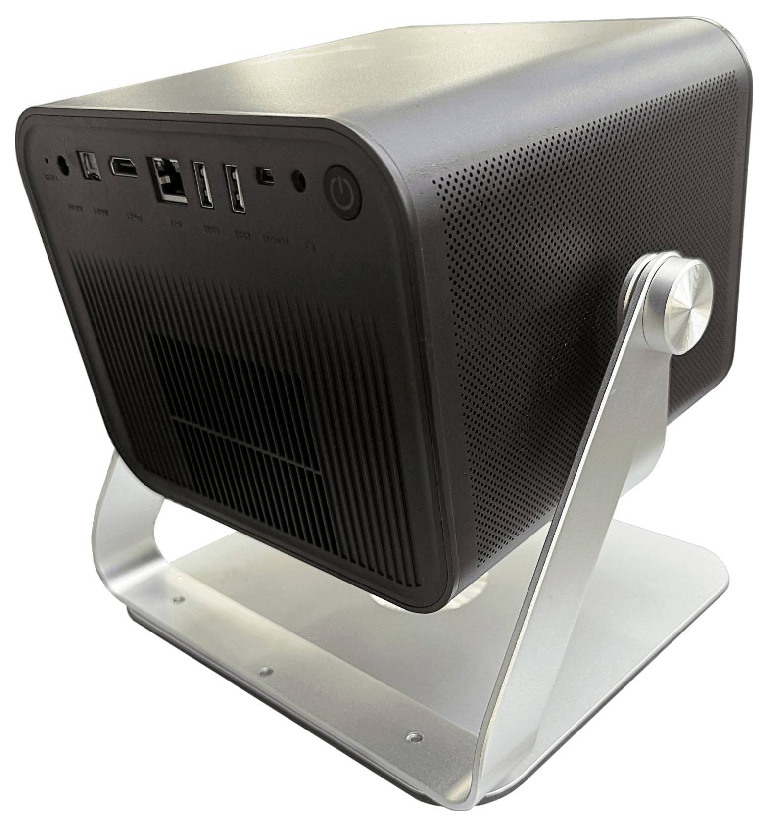 Ein schwarzes, rechteckiges elektronisches Gerät auf einem Metallständer, das mehrere Anschlüsse und Tasten auf seinem Frontpanel aufweist und einem Mini-Projektor ähnelt.