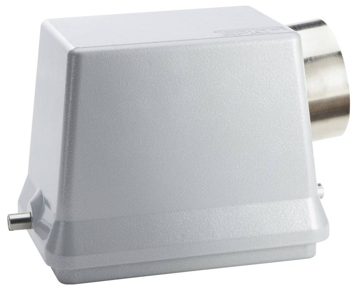 Ein grauer, eckiger, metallischer Apparat mit einem zylindrischen Fortsatz an einer Seite, möglicherweise für industrielle oder technische Zwecke verwendet.