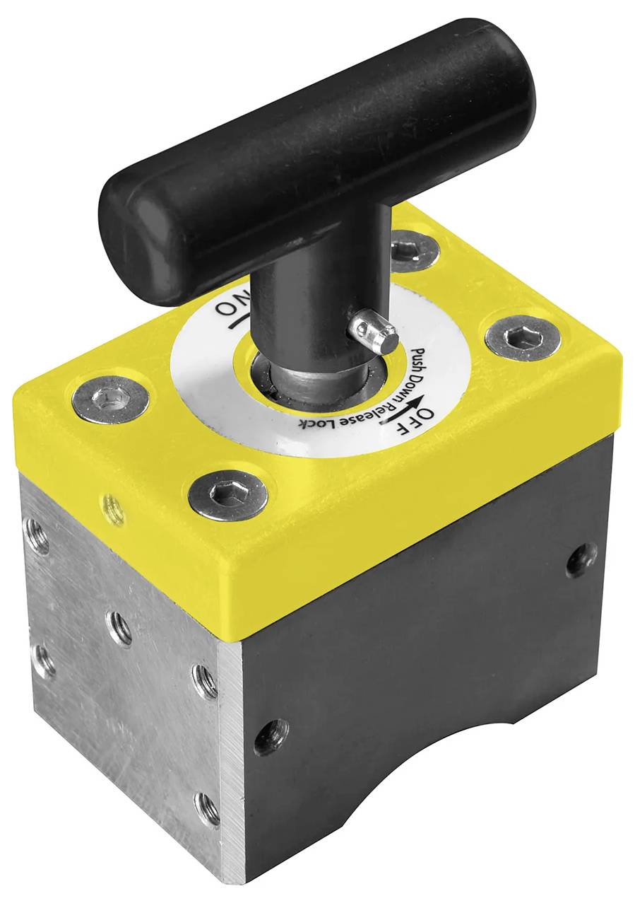 Ein rechteckiger Metallblock mit einer gelben Oberseite und einem schwarzen T-förmigen Griff. Der Griff ist mit 