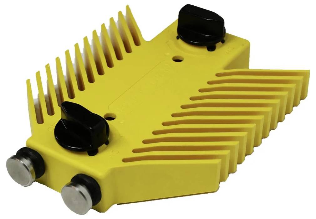 Eine gelbe Haarschneidemaschinen-Schutzabdeckung mit schwarzen Einstellknöpfen und zwei metallischen Kontaktpunkten, die für bestimmte Haarschneidemaschinen-Modelle konzipiert ist.