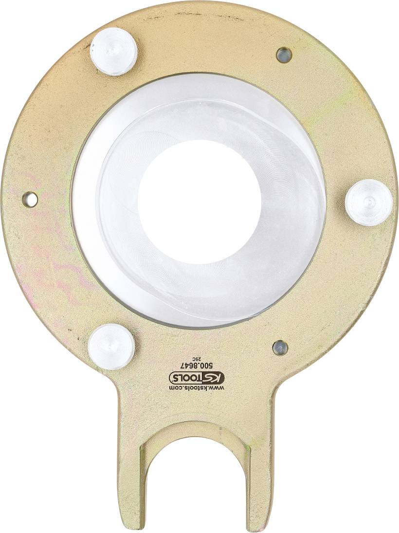 Ein kreisförmiges Metalltool mit einem zentralen Loch und drei gleichmäßig verteilten hervorstehenden weißen Stiften. Das Markenlogo 'KS Tools' ist auf der Oberfläche sichtbar.