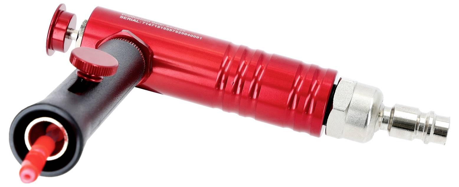 Rote und schwarze pneumatische Druckluftmaschine mit metallischem Anschluss, verwendet für industrielle Anwendungen.