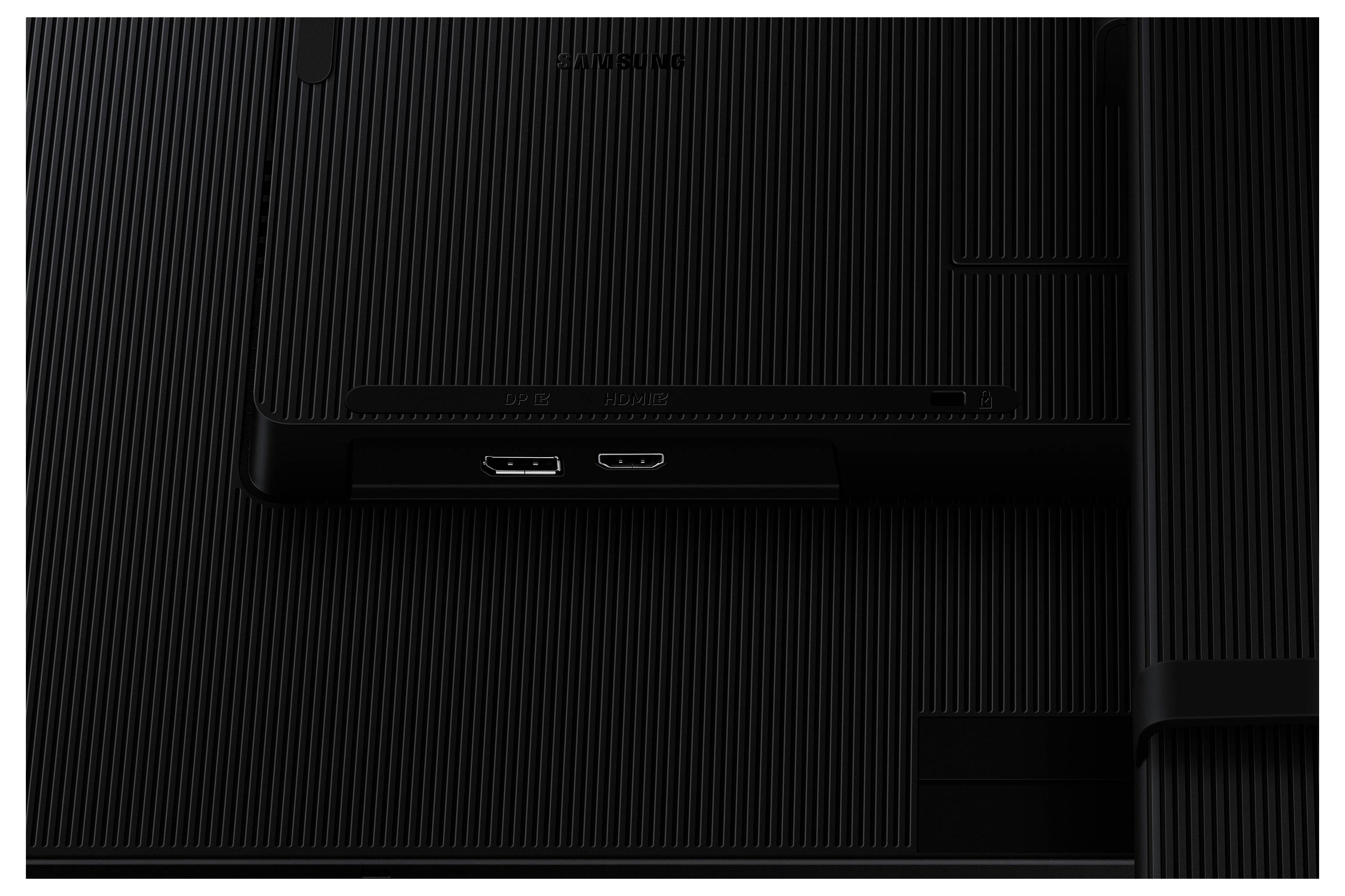 Eine Nahaufnahme der Rückseite eines schwarzen Monitors, die zwei HDMI-Anschlüsse und eine strukturierte Oberfläche zeigt.