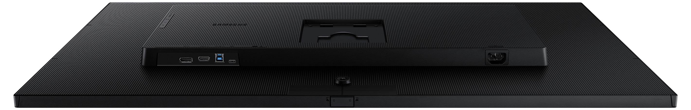 Rückansicht eines flachen, schwarzen Computermonitors mit sichtbarer Montagebefestigung und Eingabeanschlüssen auf dem unteren Panel.