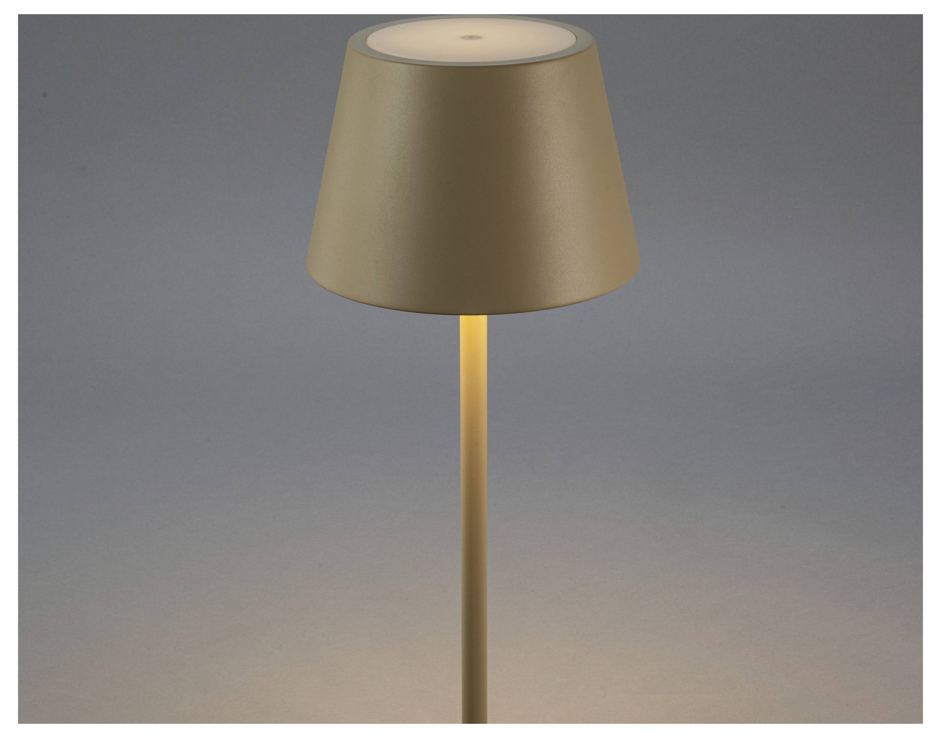 Eine minimalistische Lampe mit einem beigen Lampenschirm verbreitet einen warmen Schein vor einem dezenten grauen Hintergrund und vermittelt eine ruhige und moderne Ästhetik.