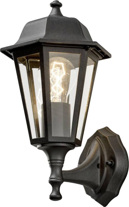 Eine schwarze Außenwandlaterne mit klaren Glasscheiben, die eine freigelegte Glühbirne zeigt und auf einer dekorativen Basis montiert ist.