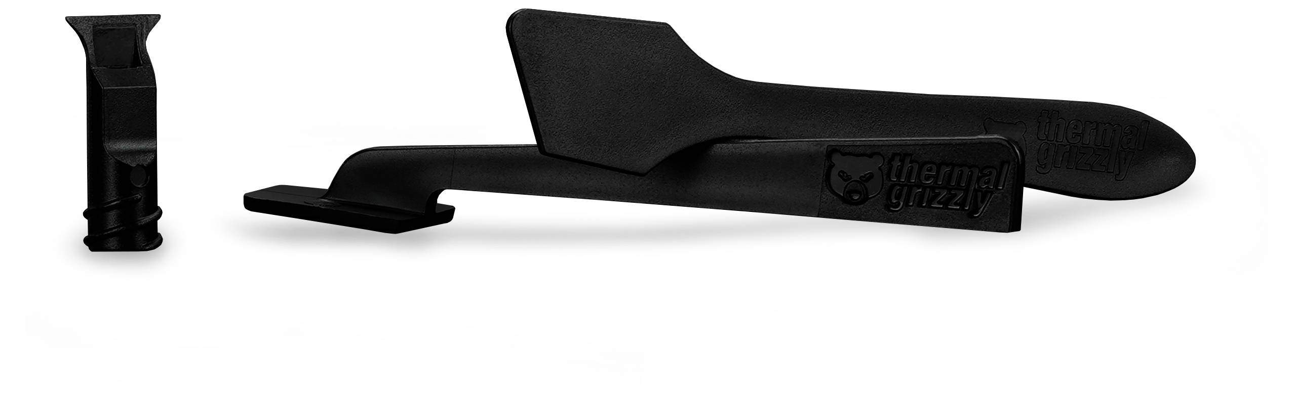 Werkzeugset von 'Thermal Grizzly', bestehend aus einem Kunststoff-Spatel und einer Spritzenkappe zur effizienten Auftragung von Wärmeleitpaste.