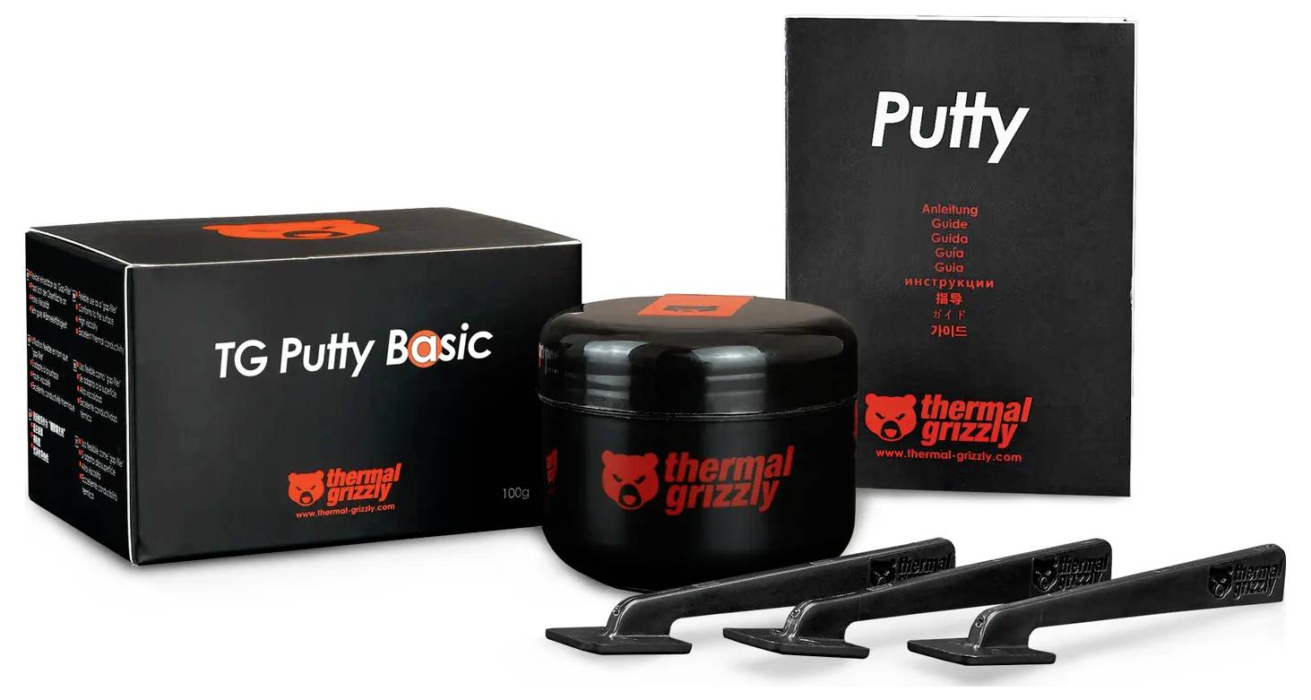 'TG Putty Basic' von Thermal Grizzly enthält ein Gefäß Wärmeleitpaste, eine Anleitung und Werkzeuge zur Anwendung. Die Verpackung präsentiert die Unternehmensmarke.
