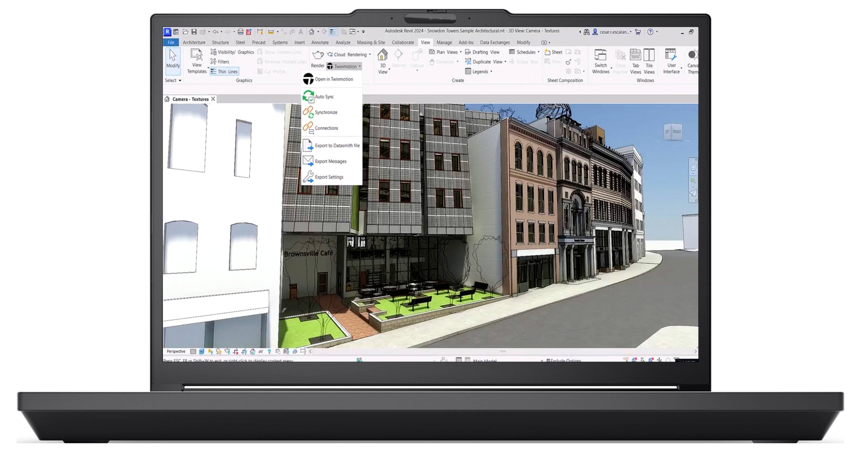 Ein Laptop-Bildschirm zeigt eine 3D-architektonische Visualisierung mit einer Reihe von Gebäuden und einer Straße, wobei Softwaremenüs am oberen Rand sichtbar sind.