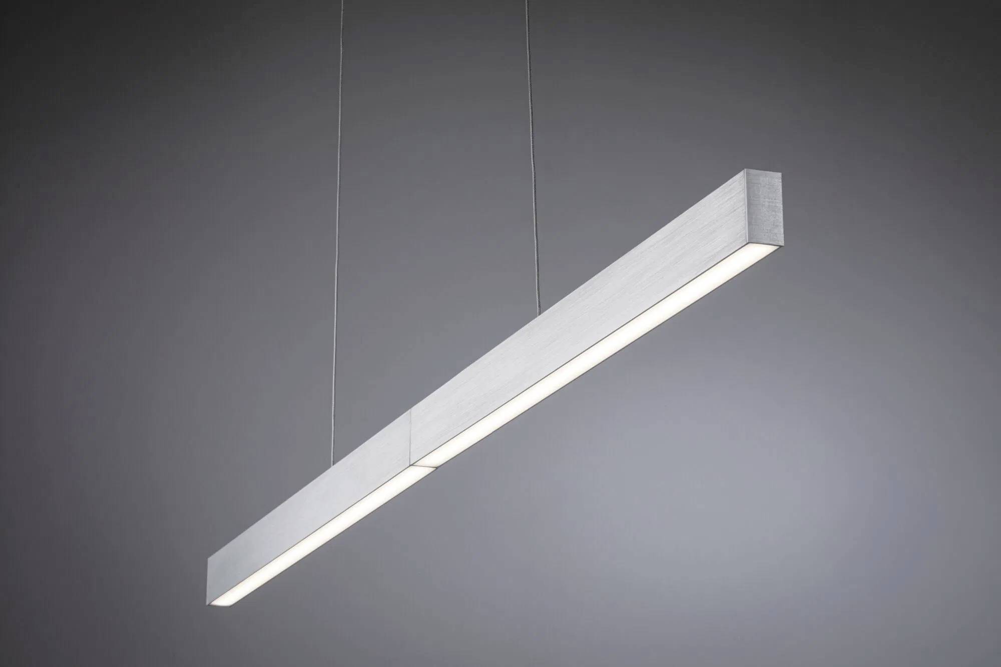 Eine moderne, minimalistische rechteckige Pendelleuchte strahlt weiches weißes Licht vor einem grauen Hintergrund aus und betont ihr schlankes, zeitgenössisches Design.