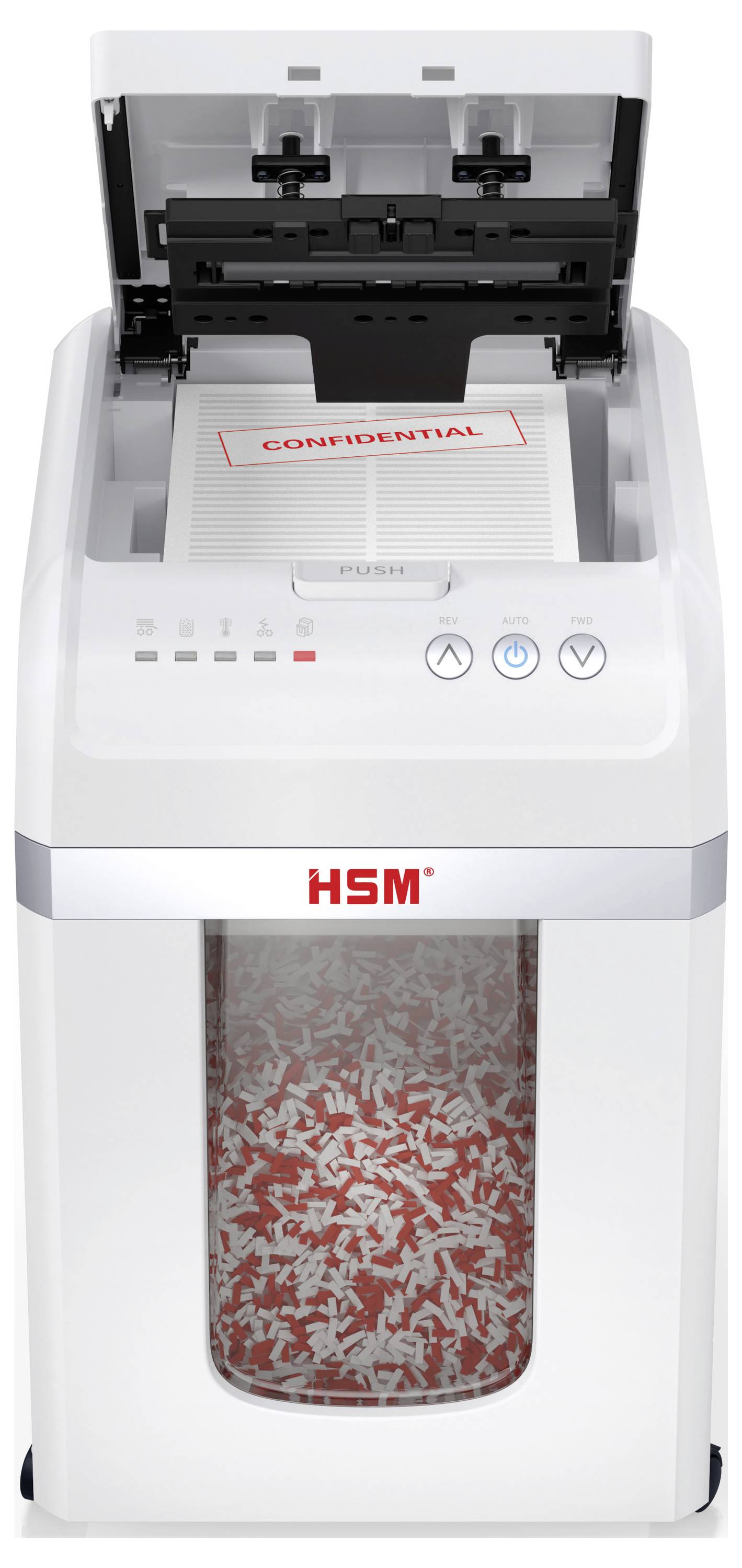 Ein Dokumentenvernichter mit zerrissenen Papierstreifen im Auffangbehälter darunter. Ein Blatt mit der Aufschrift 