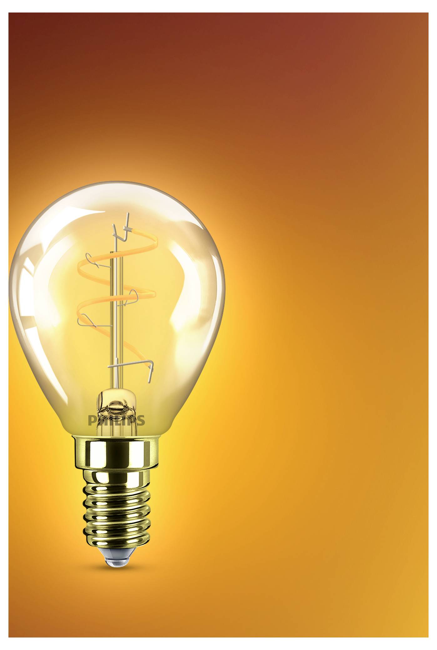 Eine beleuchtete Edison-Glühbirne mit sichtbarem Glühfaden leuchtet vor einem orangefarbenen Hintergrund und symbolisiert eine Idee oder ein Innovationskonzept.