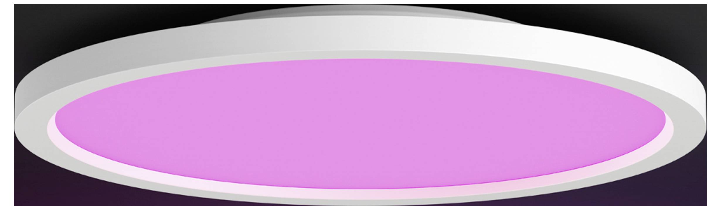 Eine kreisförmige LED-Deckenleuchte mit einem rosa Leuchten, umgeben von einem weißen Rahmen, an einer dunklen Decke montiert.