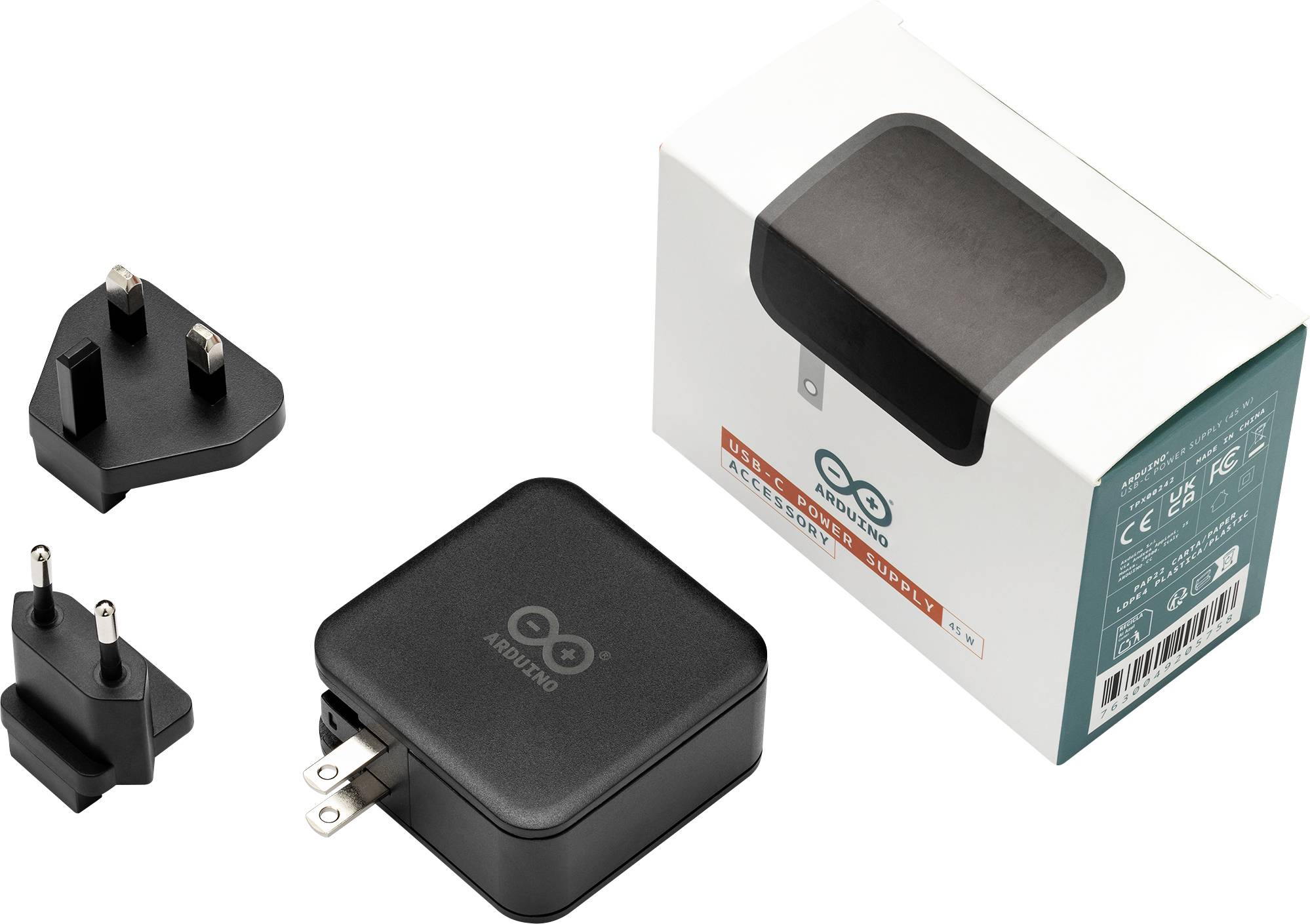 Power-Adapter der Marke 'ARDUINO' mit internationalen Steckadaptern und Verpackung.