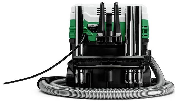 Staubsauger mit einer aufgewickelten Schlauch- und Stromleitung, mit einem grün-weißen Design, von vorne betrachtet.