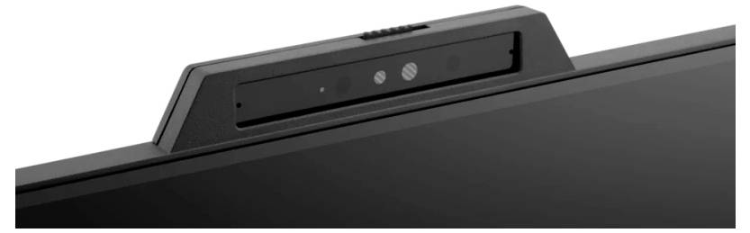 Eine Nahaufnahme einer Laptop-Kamera mit zwei Linsen und einem Schieberegler über einem Bildschirm.
