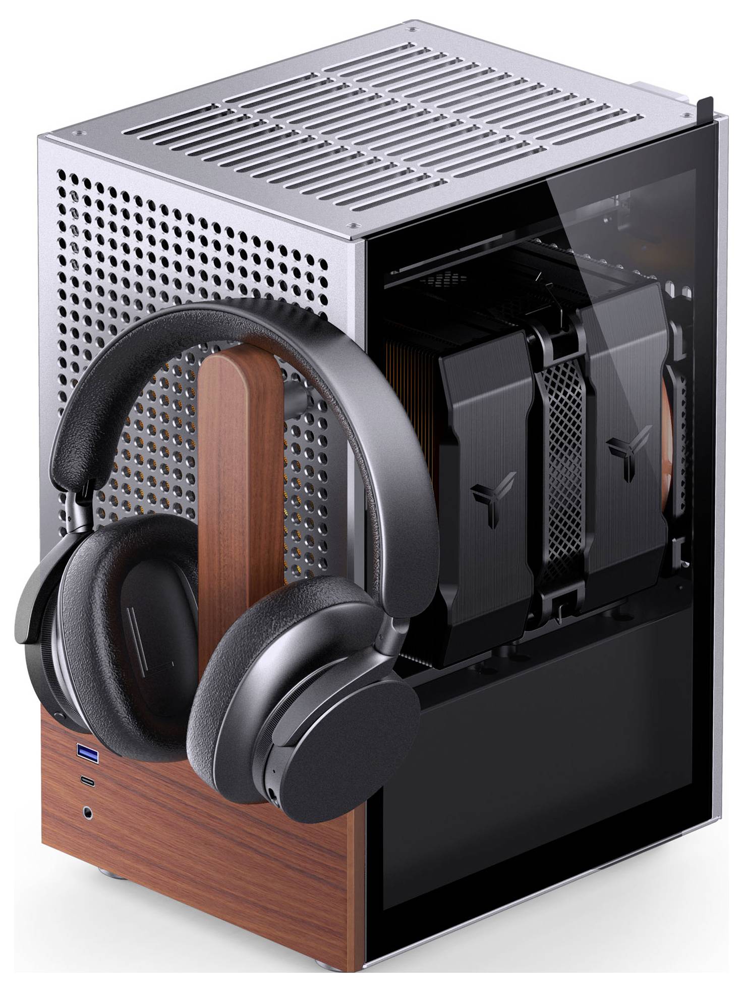 Ein schlanker Desktop-Computer mit einer holzakzentuierten Basis und modernen Kopfhörern ruht daneben und unterstreicht ein stilvolles technisches Setup.