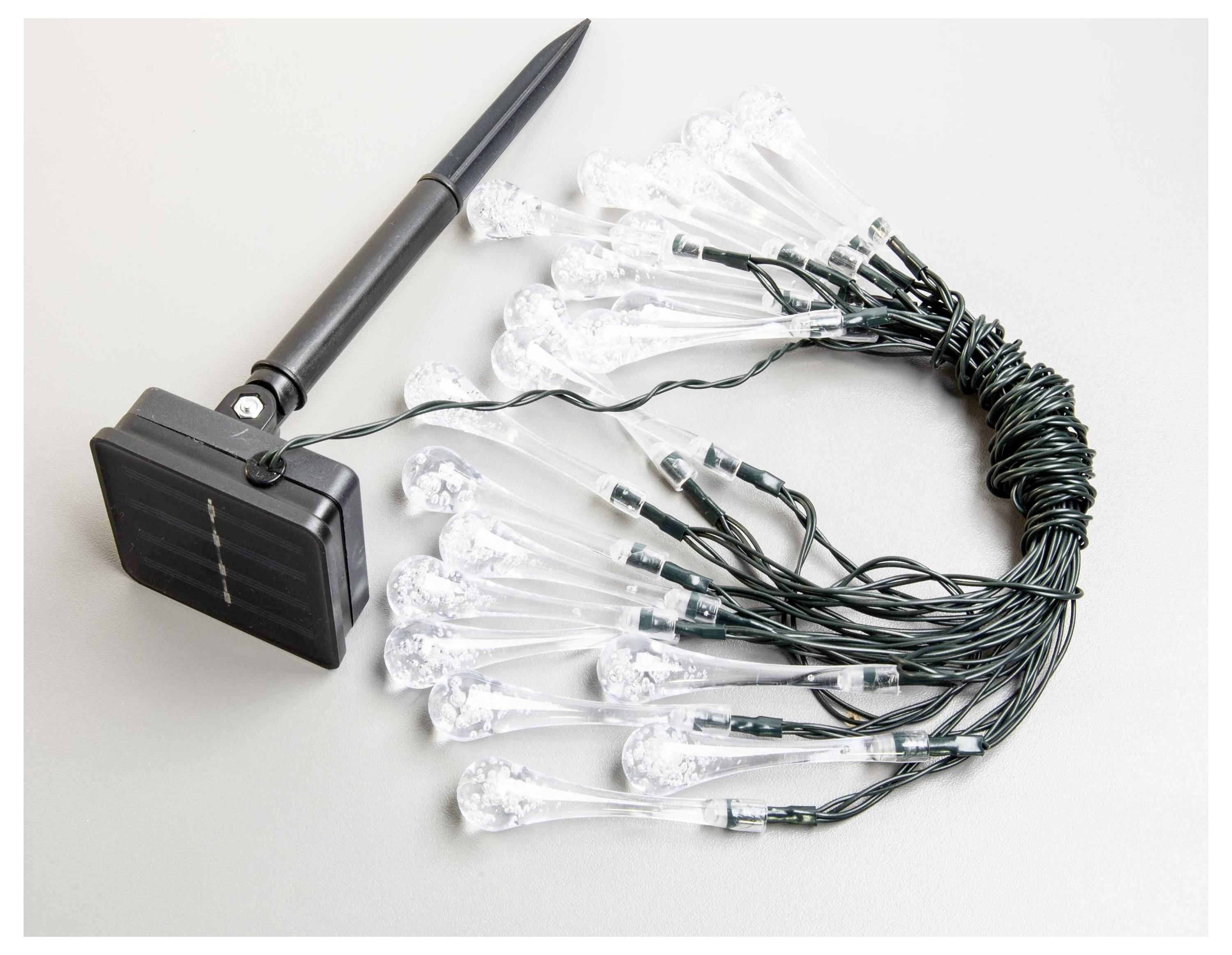 Eine Reihe von solarbetriebenen LED-Leuchten mit einem schwarzen Solarpanel, das mit mehreren transparenten Glühbirnenabdeckungen an einer Seite versehen ist.