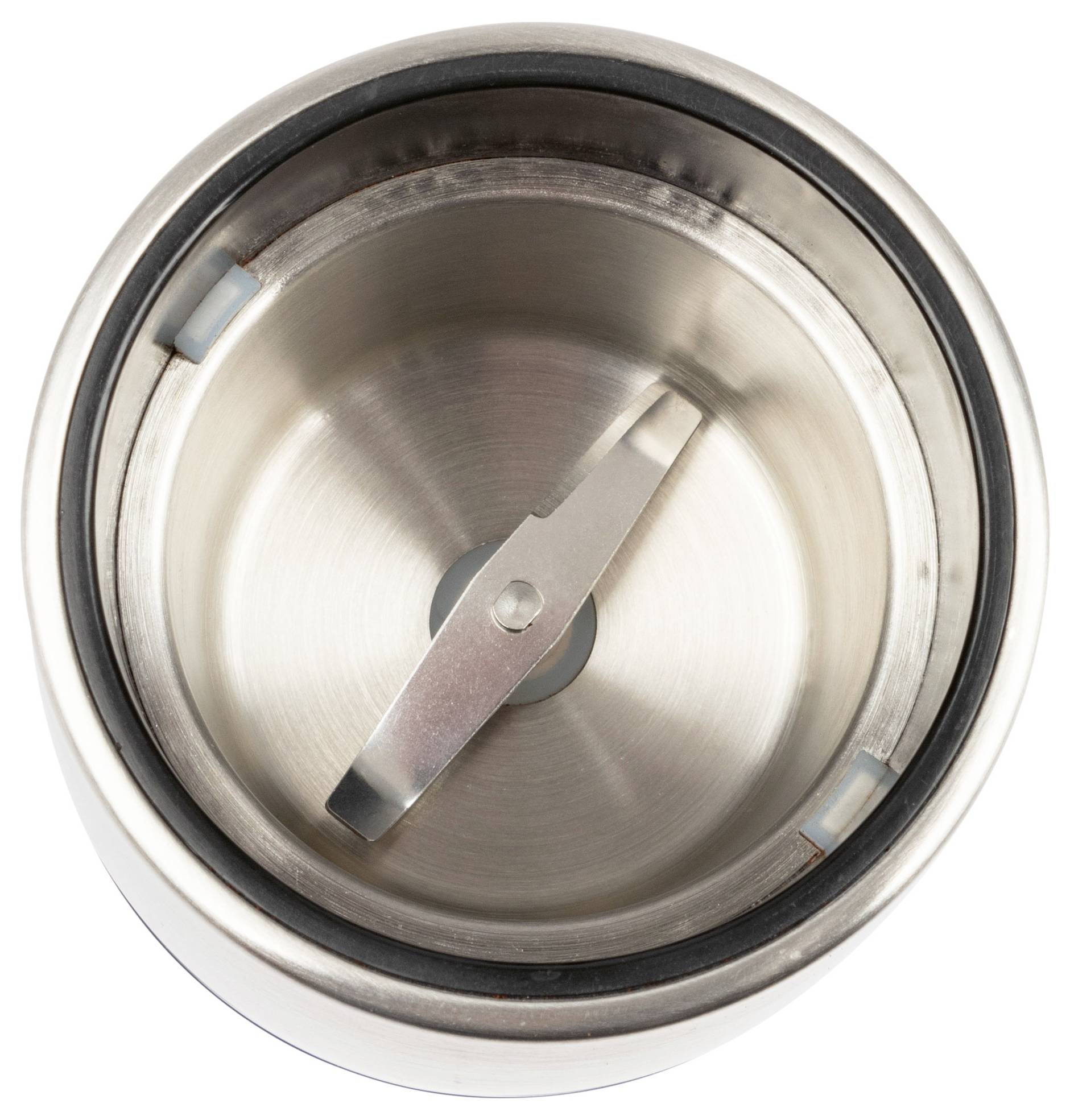 Draufsicht einer Edelstahl-Kaffeemühle mit einer scharfen Klinge im Zentrum, die das Design der Innenkammer zeigt.