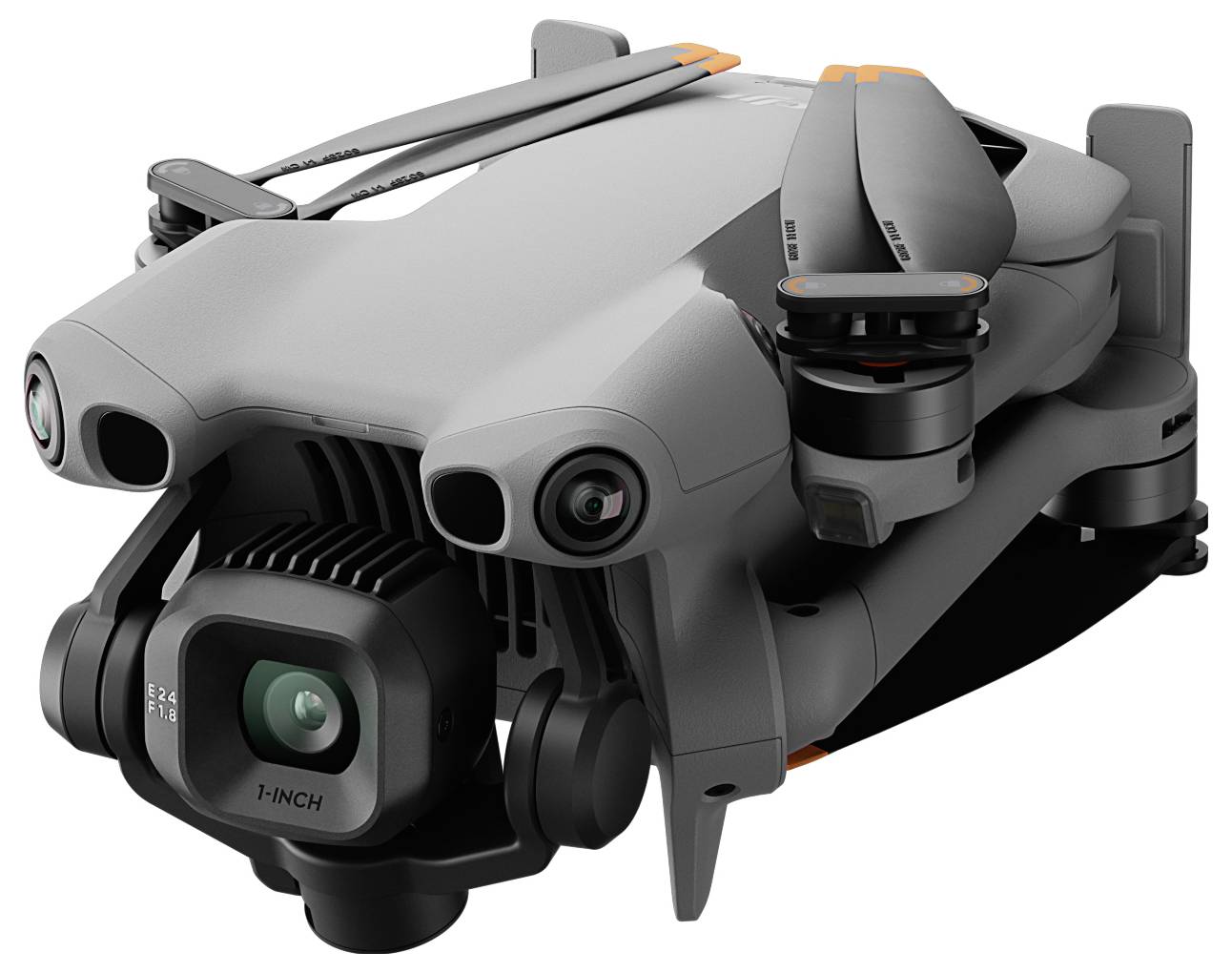 Eine kompakte, graue Quadcopter-Drohne mit einer an der Front montierten Kamera, deren Arme und Propeller zusammengeklappt sind und die transportbereit ist.