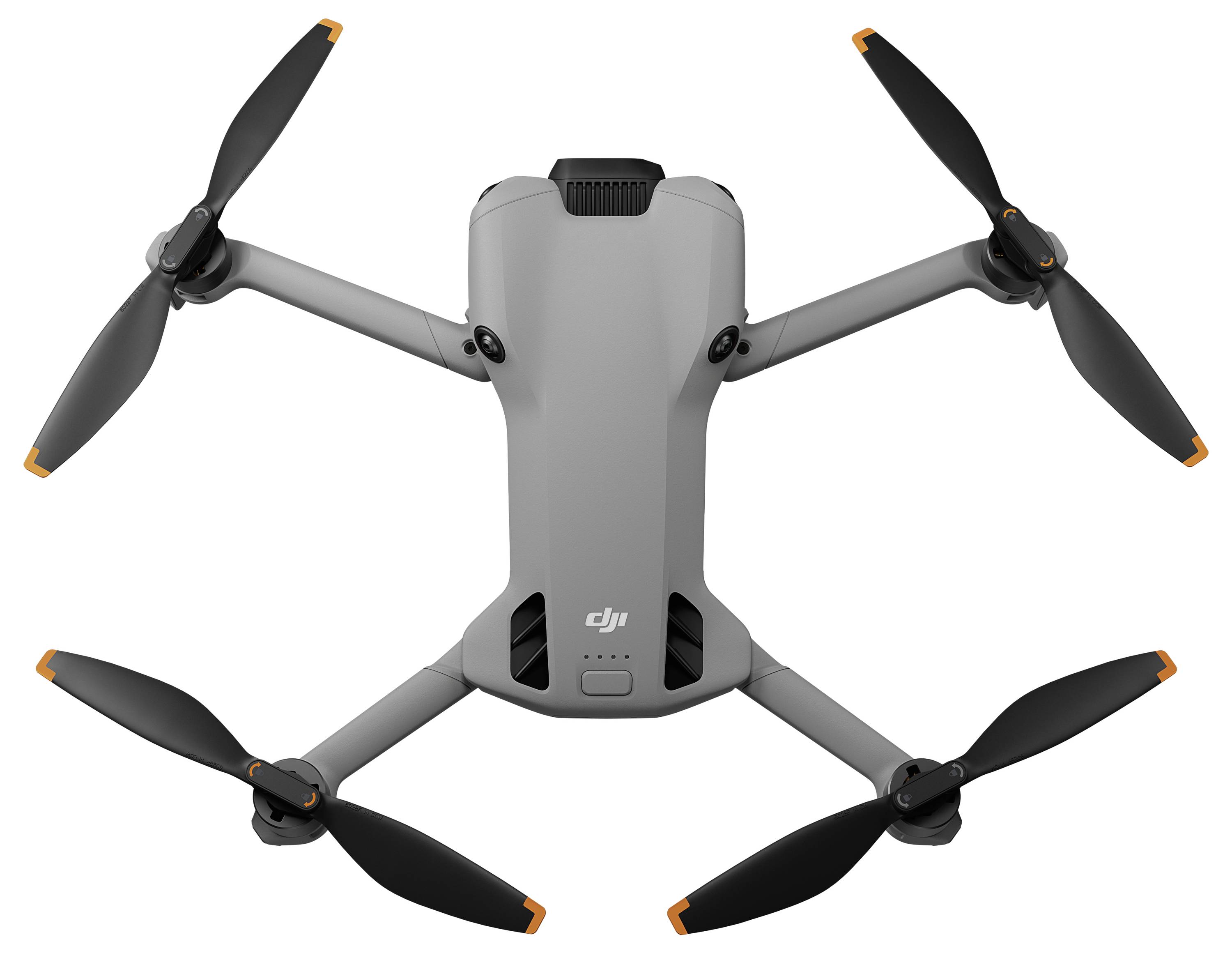 Eine graue Quadcopter-Drohne mit vier ausgestreckten Propellern, die ein kompaktes Design und eine kleine Kamera an der Front für Luftaufnahmen aufweist.