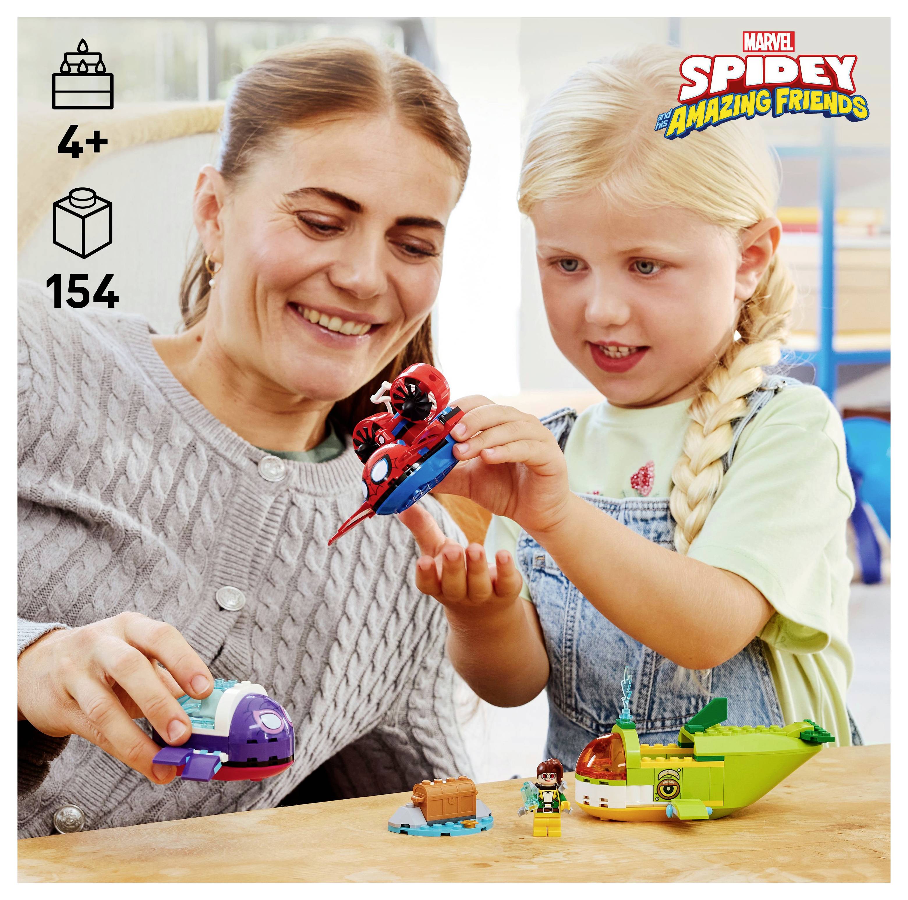 Ein Kind und ein Erwachsener bauen LEGO 'Spidey und seine fantastischen Freunde' Sets gemeinsam. Die Box zeigt das Alter 4+ und enthält 154 Teile.