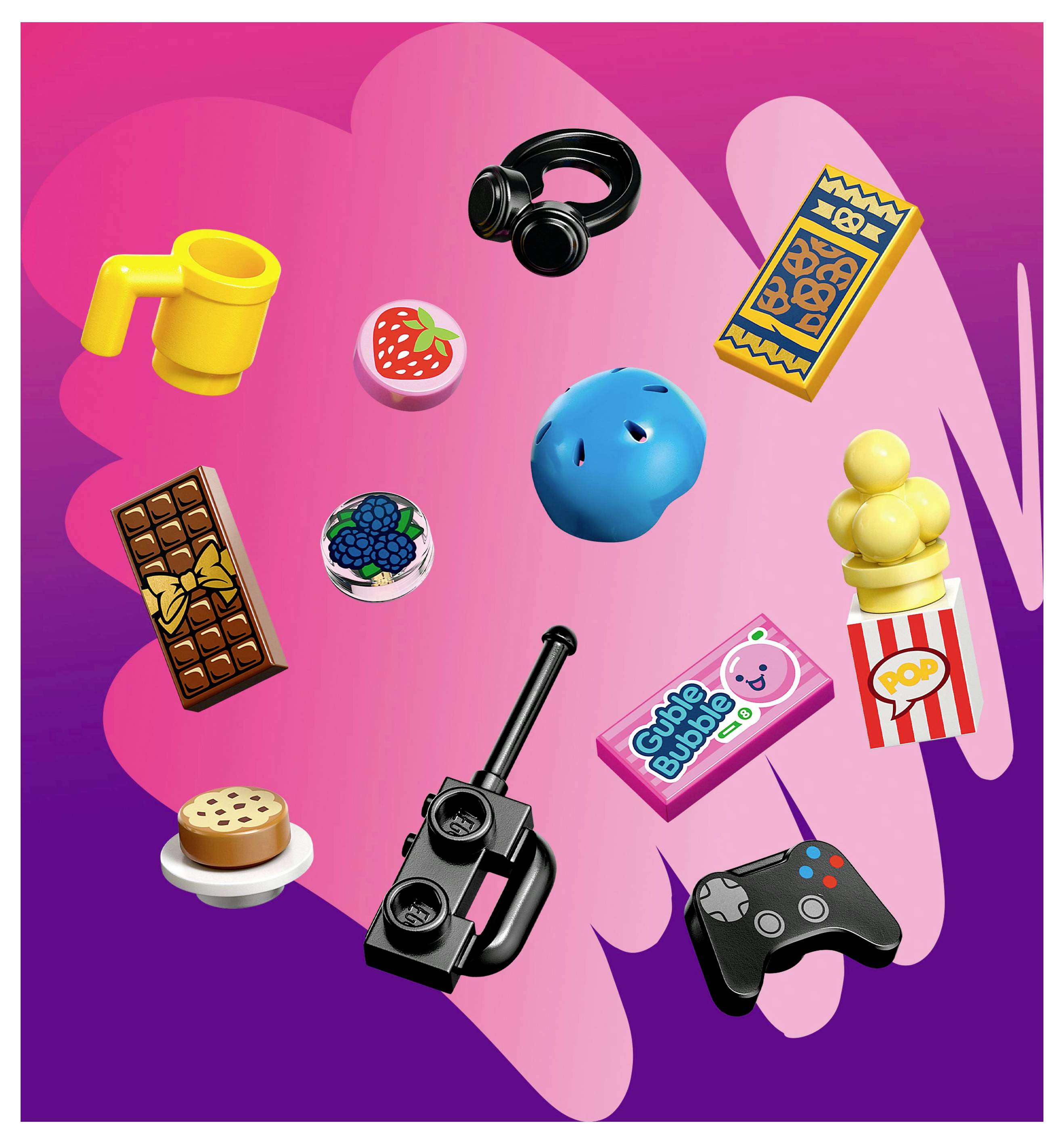 Eine Auswahl bunter Gegenstände: Kopfhörer, Schokolade, ein Videospiel-Controller, ein Donut, Popcorn sowie verschiedene Süßigkeiten und Spielzeuge.