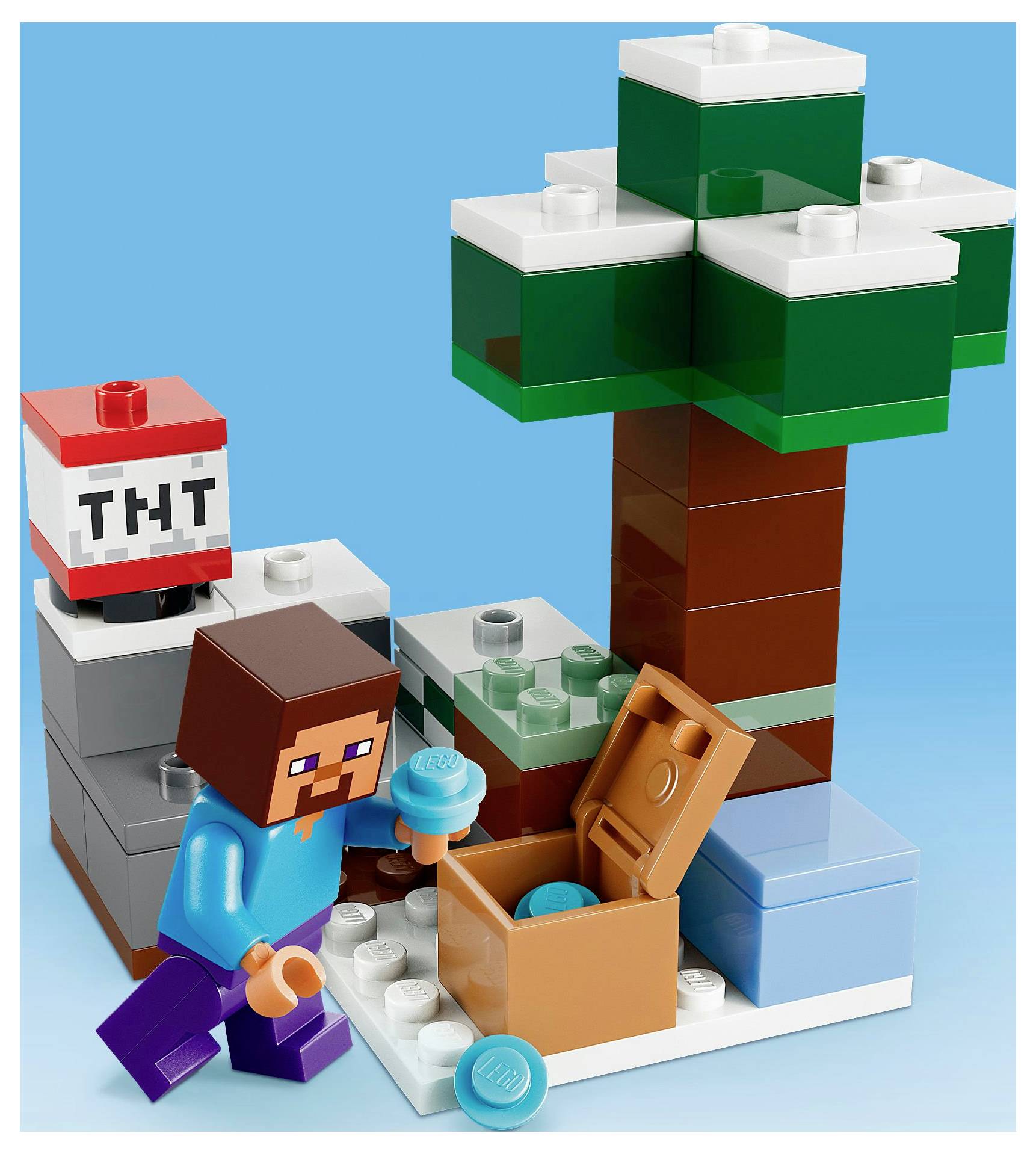 Eine eckige Figur in einem blauen Hemd und lila Hosen steht neben einer Schatztruhe mit einem blauen Objekt, neben einem Baum und einem TNT-Block.