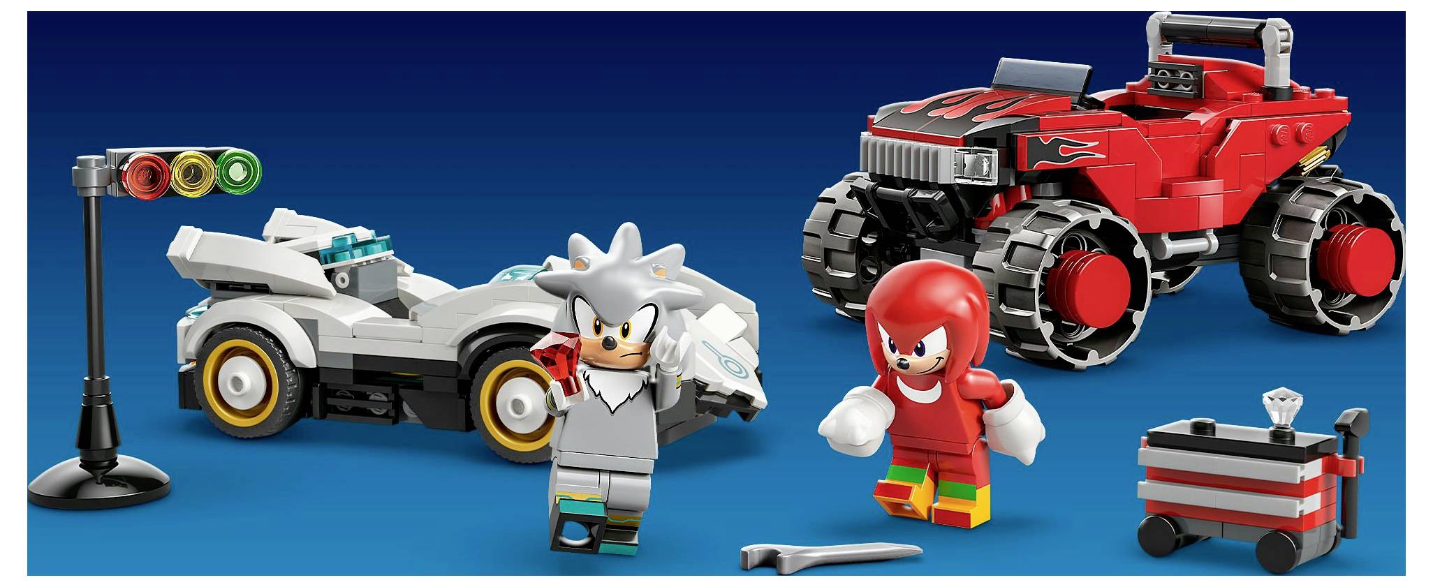 Zwei Comicfiguren, eine in Silber und eine in Rot, stehen neben Spielzeugautos und einer kleinen Verkehrsampel auf blauem Hintergrund.